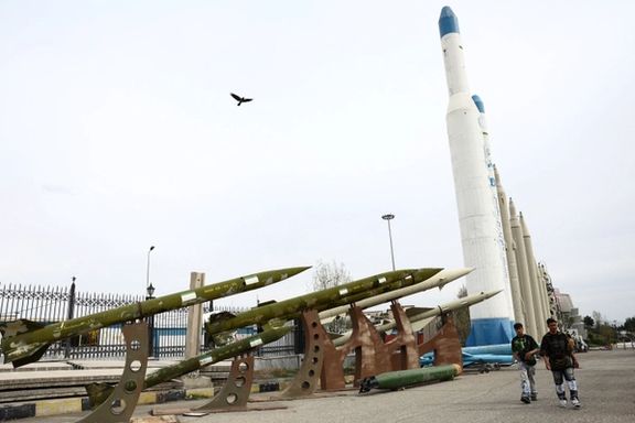 People walk near Iranian missiles in a park in Tehran, March 26, 2026.