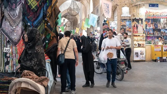 People walk and shop at Mashad's grand bazaar in northeast Iran, September 28, 2025