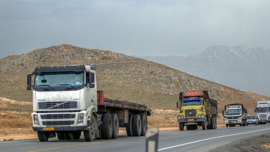 Iranian trucks on the road near the border to the north. Undated