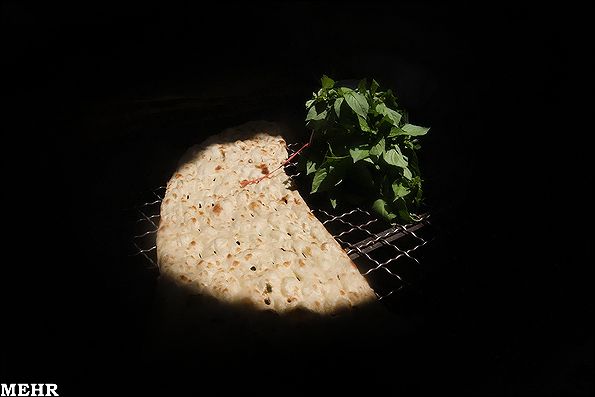 A traditional Iranian Sangak is left to cool down on a metal mesh table at a Tehran bakery (File photo)