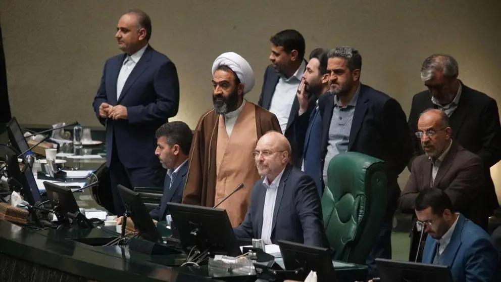 Parliament speaker Ghalibaf with a group of lawmakers during a session.