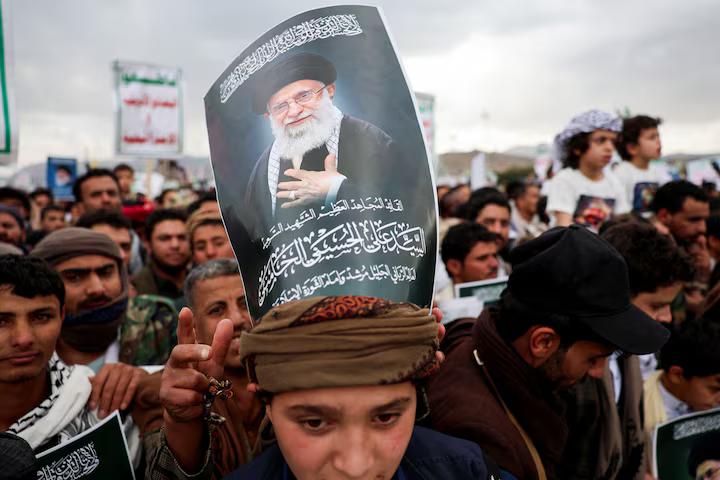 A poster bearing an image of late Iranian Supreme Leader Ayatollah Ali Khamenei is seen at a rally with Houthi supporters in Sanaa, Yemen, March 6, 2026.orters in solidarity with Iran and Lebanon in Sanaa, Yemen, March 6, 2026