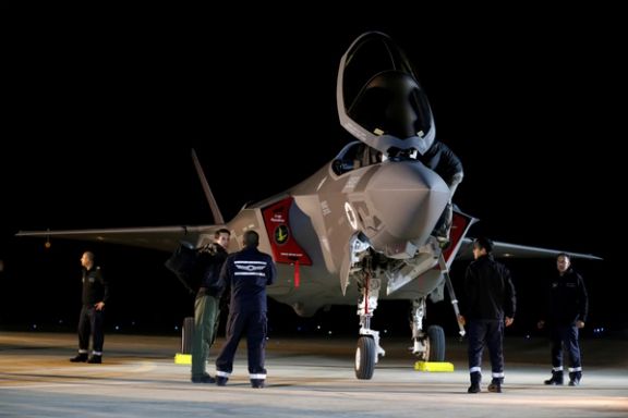 Israeli soldiers walk near a F-35 fighter jet after it landed in Israel at Nevatim air base after the Israeli air force bought them at Nevatim in southern Israel December 12, 2016.