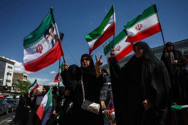 Iran officials celebrate ceasefire as critics warn it could stall change
