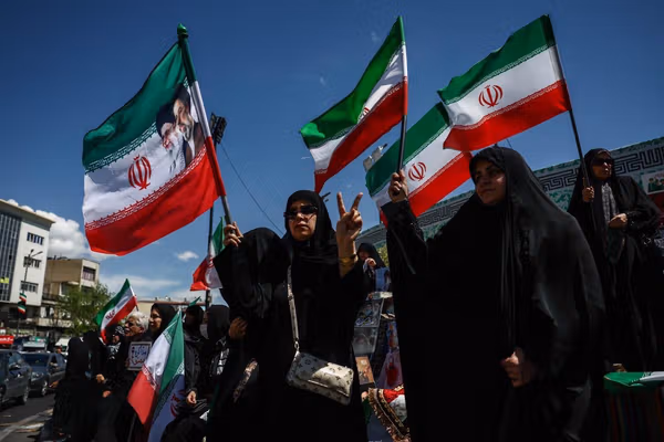 Iran officials celebrate ceasefire as critics warn it could stall change